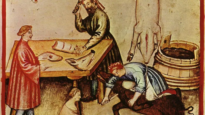Ilustração do século XIV do tratado medieval sobre o bem-estar Taccuino Sanitatis, mostrando duas mulheres tomando parte activa nas lides de um açougue, num modelo que não será muito diferente do usado no Funchal quatrocentista. (Atribuição: PESP / Wikimedia CC-BY-SA 4.0)